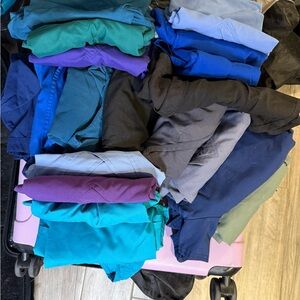 17 scrub tops size small and medium